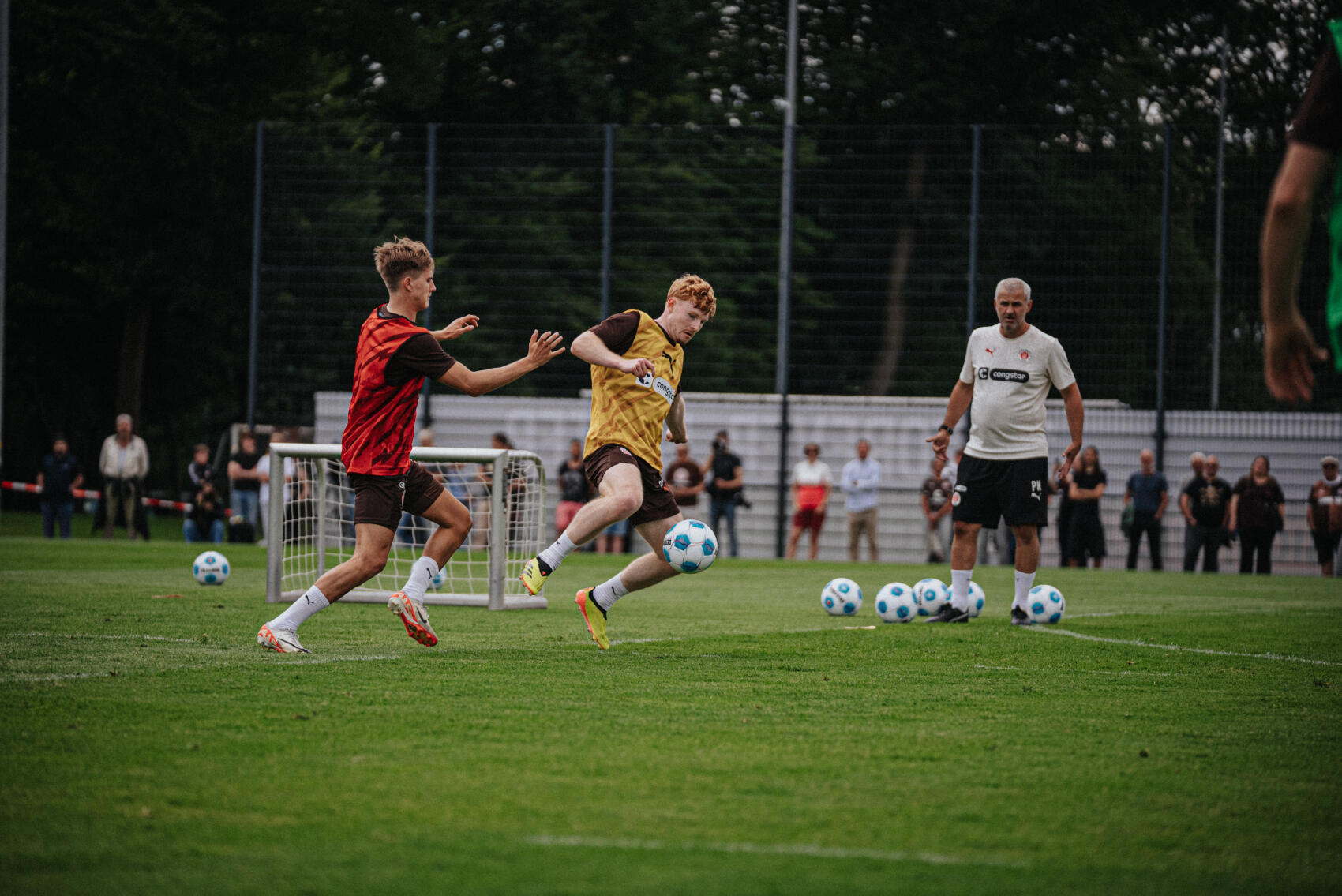 New acquisition Robert Wagner (yellow bib) under challenge from Erik Ahlstrand (red bib).