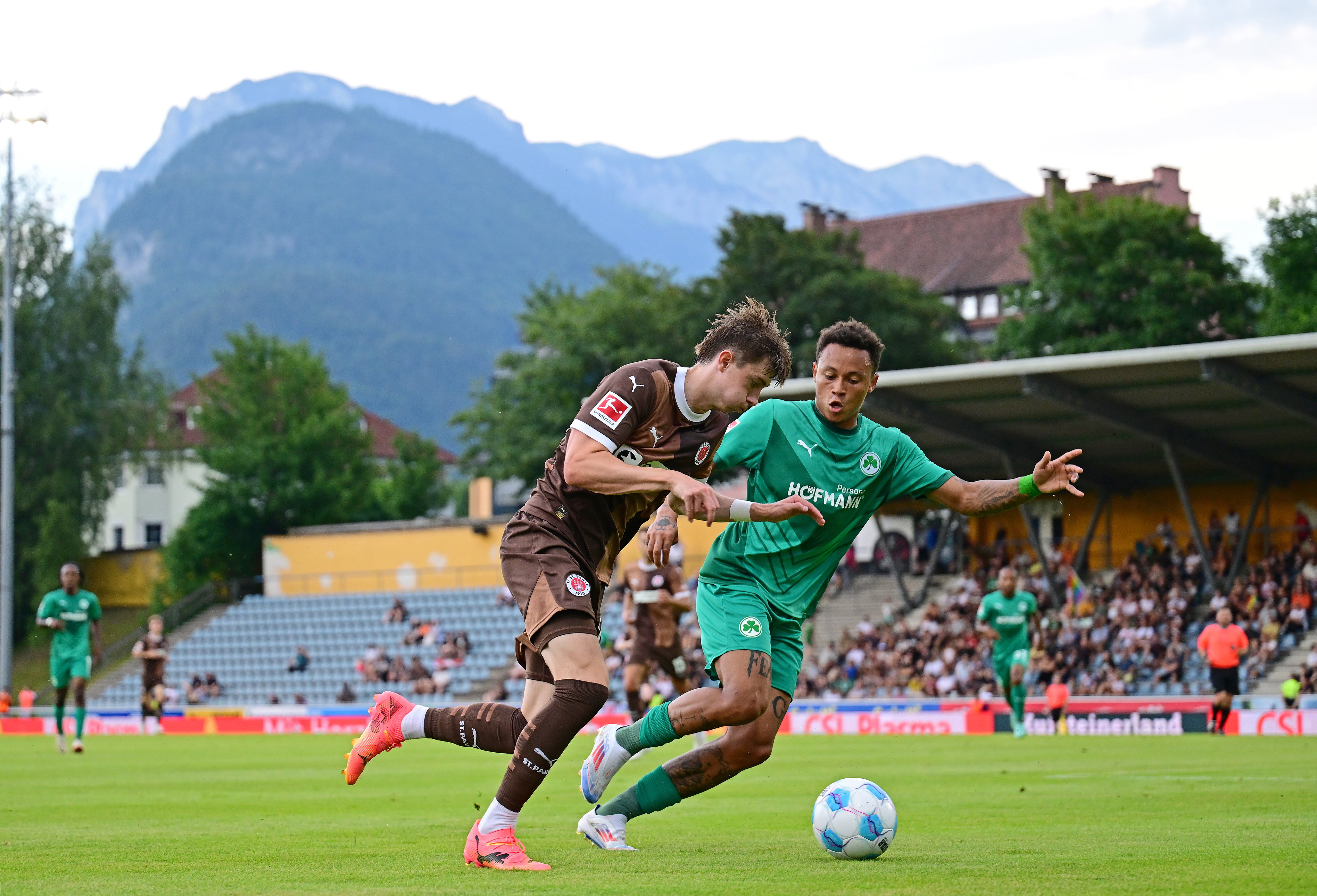 Scott Banks under challenges from Fürth's Roberto Massimo, who opened the scoring for the second-division side after 29 minutes.